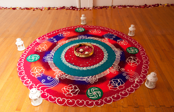 Rose & Swirl Rangoli with Lanterns — Indoor Setting
